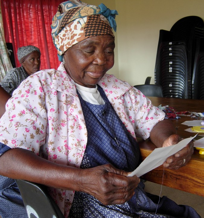 Emma Mambene of Sabie reads her letter from her partner, Shirley B. of Vernon.