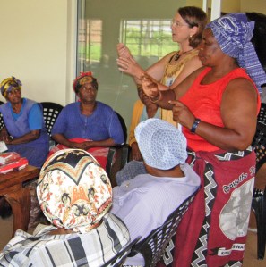 bevteaching Attentive South African grandmothers learn sewing skills from Beverley Barling in an effort to improve the hardships in their lives