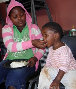 Always one sees older children assisting the younger ones