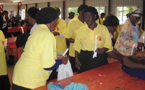 Gogos light candles for World AIDS Day Rally