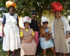 Gogos set off with their food parcels containing eggs, rice, beans and sardines. 